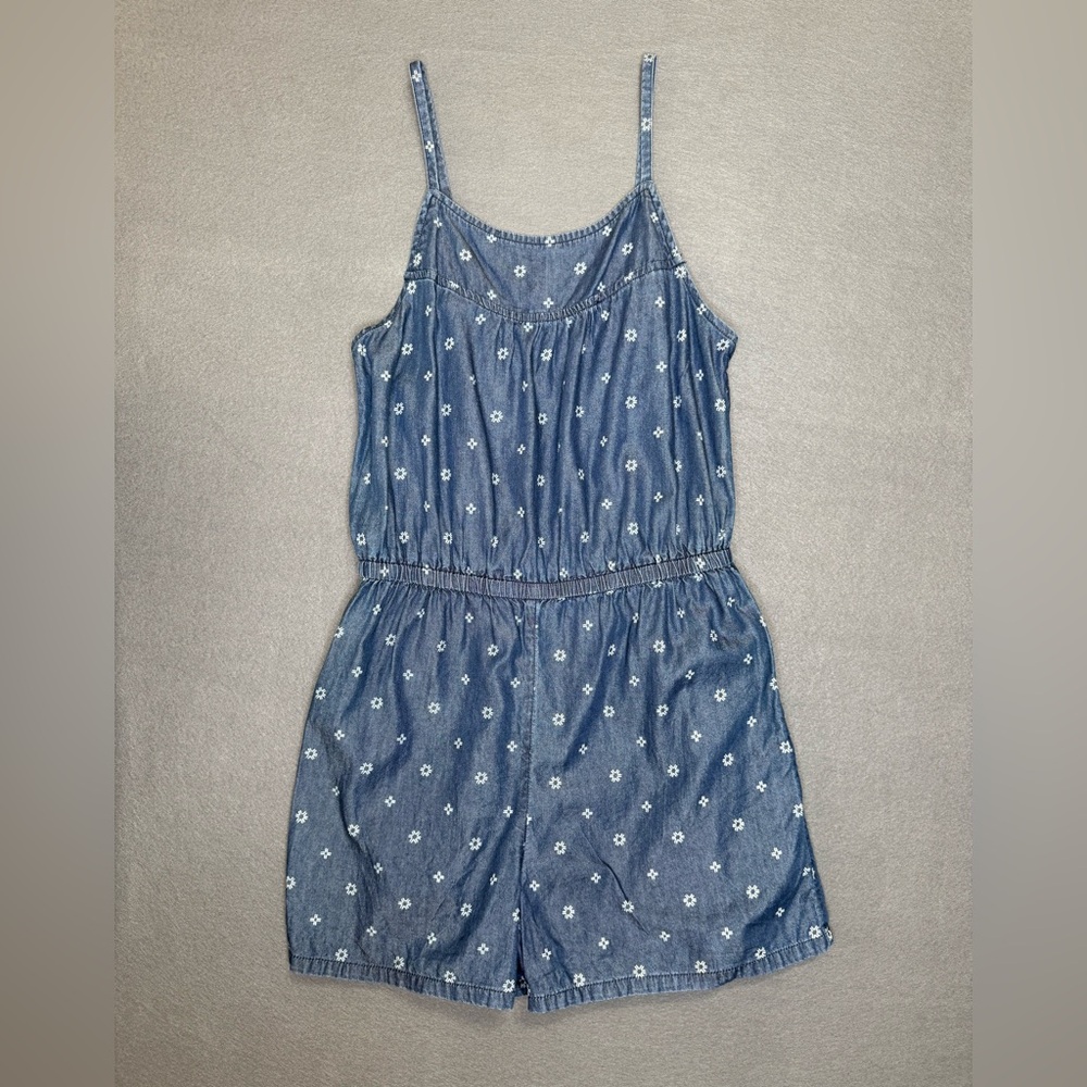 Old Navy Sleeveless Blue Denim Shorts Romper with White Star Pattern.